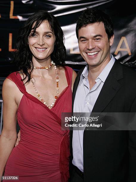 Canadian actress Carrie-Anne Moss wearing a rose Donna Karan Collection chiffon/jersey and tulle dress and husband actor Steven Roy arrive at the...