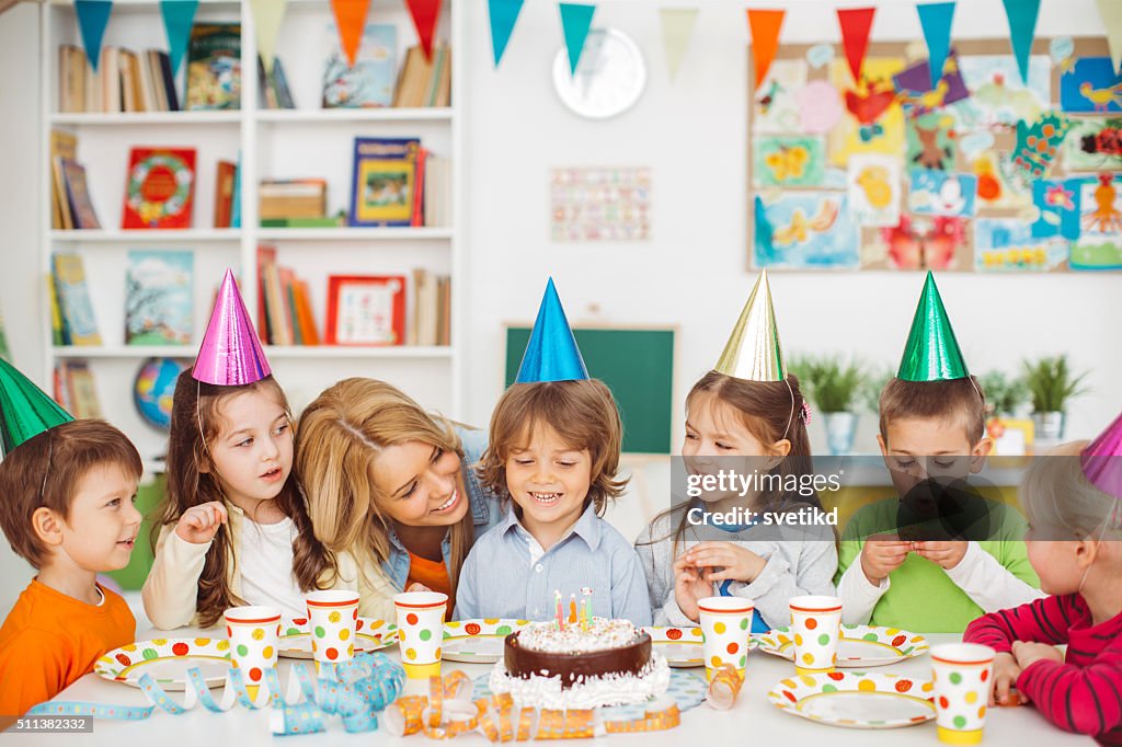 Blowing out his birthday candle