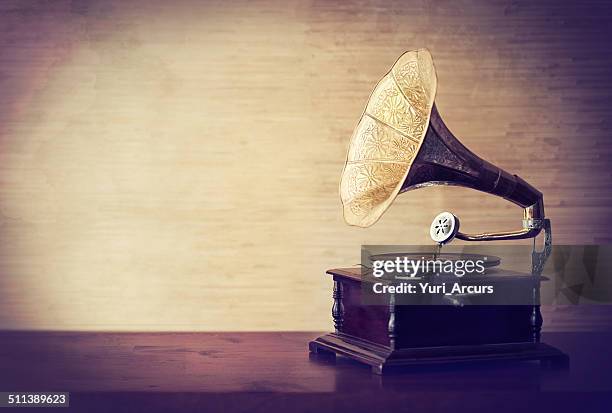 getting lost in the music of old - gramophone stockfoto's en -beelden