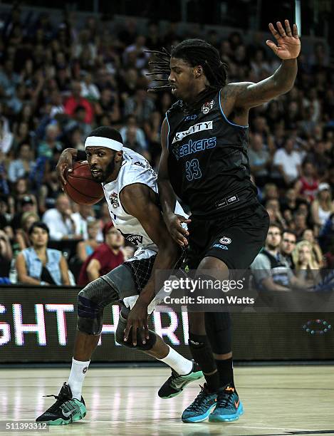 Hakim Warrick of Melbourne looks to drive past Charles Jackson of the Breakers during the NBL Semi Final match between the New Zealand Breakers and...