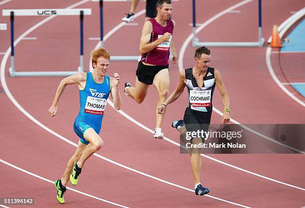 Tristan Thomas of Tasmania and Michael Cochrane of New Zealand compete in the Mens 400 Metre Hurdles Race during the Canberra Track Classic at the...