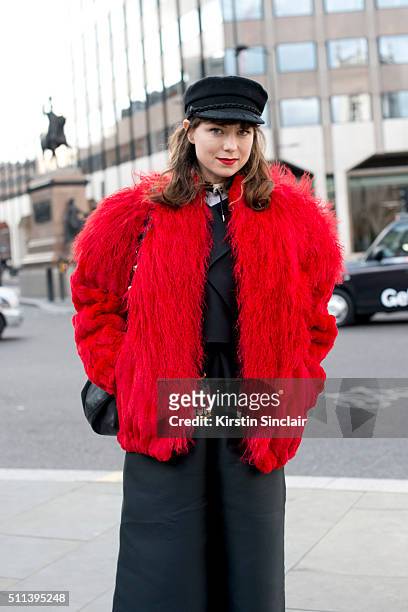Red Thread magazine editor-in-chief Beth Buxton wears a vintage coat, Gayeon Lee culottes and top, and Mulberry bag on day 1 during London Fashion...