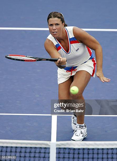 Jennifer Capriati of the USA rushes the net against Alina Jidkova of Russia during the second round of the Rogers Cup on August 3, 2004 at Uniprix...