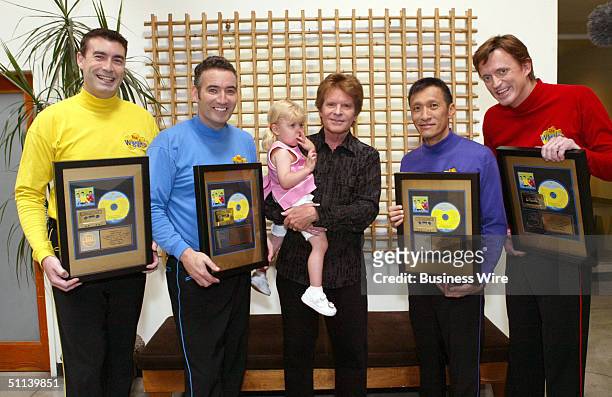 Rock 'n' Roll Hall of Famer John Fogerty poses for a photo as he congratulates preschool superstars The Wiggles on their first U.S. Gold Album for...