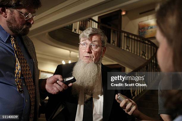 Farmer, businessman, and U.S. Senate Republican hopeful Raymond Defenbaugh speaks with reporters outside a special meeting of the Illinois Republican...