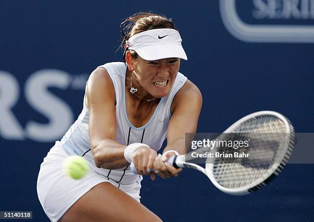 Ai Sugiyama of Japan double arms a backhand against Daniela Hantuchova of Slovakia during the second round of the Rogers Cup on August 3, 2004 at...
