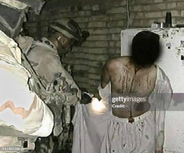Grab taken from the Qatar based Al-Jazeera television news network 04 December 2004, shows a photograph of what appears to be a prisoner being held...