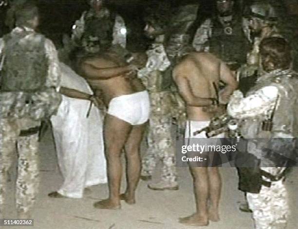Grab taken from the Qatar based Al-Jazeera television news network 04 December 2004, shows a photograph of what appears to be prisoners being held at...