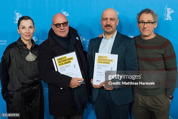 Actress Meret Becker and director Dani Levy, both members of the Amnesty Internationel Jury pose together with the award winners Mehrdad Oskoue...