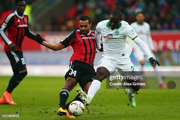 Anthony Ujah of Bremen is challenged by Marvin Matip of Ingolstadt during the Bundesliga match between FC Ingolstadt and Werder Bremen at Audi...