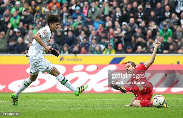 Mahmoud Dahoud of Borussia Moenchengladbach scores his team's first goal during the Bundesliga match between Borussia Moenchengladbach and 1. FC...