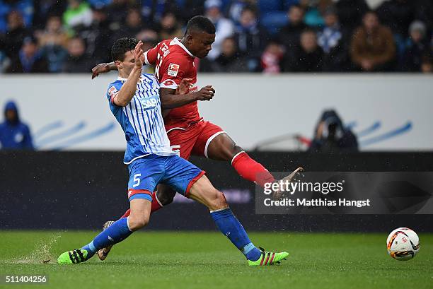 Jhon Cordoba of Mainz scores his team's first goal past Fabian Schaer of Hoffenheim during the Bundesliga match between 1899 Hoffenheim and 1. FSV...