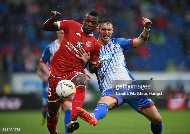 Jhon Cordoba of Mainz is challenged by Niklas Suele of Hoffenheim during the Bundesliga match between 1899 Hoffenheim and 1. FSV Mainz 05 at Wirsol...