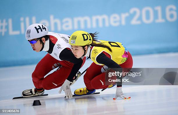 In this handout image supplied by the IOC, Ma Wei of China and Gong Li of China compete in the Short Track Speed Skating Mixed NOC Team Relay...