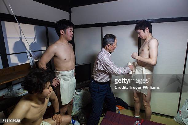 Men are fitted into loincloths at the Hadaka Matsuri, or Naked Festival at Saidaiji Temple on February 20, 2016 in Okayama, Japan. Some 9,000 men...