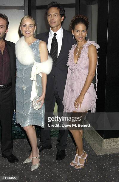 Actors Sharon Stone, Benjamin Bratt and Halle Berry arrive for the European Premiere of "Catwoman" at Vue Leicester Square August 3, 2004 in London,...