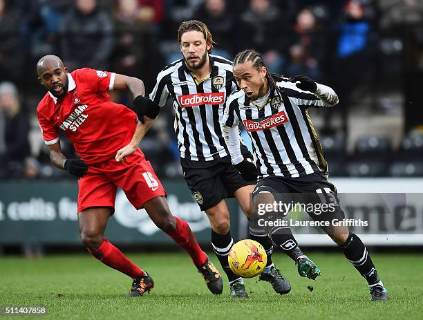 Curtis Thompson and Alan Smith of Notts County battle with Nigel Atangana of Leyton Orient during the Sky Bet League Two match between Notts County...