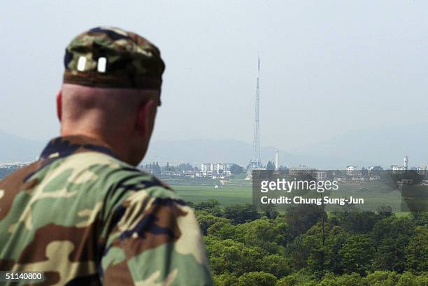Soldier looks over North Korea as they stand guard at the check point in the demilitarized on August 4 2004 in South Korea. North Korea is reportedly...