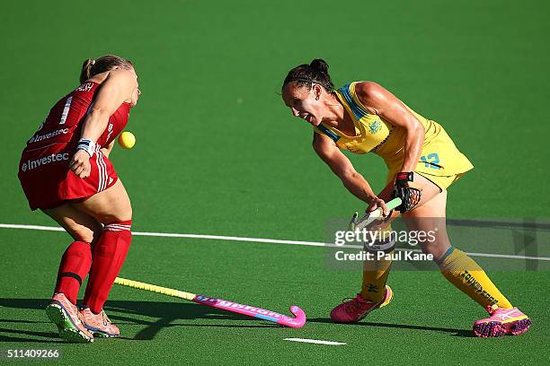 Madonna Blyth of Australia shoots on goal against Kate Richardson-Walsh of Great Britain during the International Test match between the Australian...
