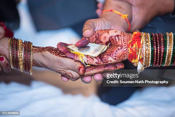hindu wedding rituals - indian rupee coin stock-fotos und bilder