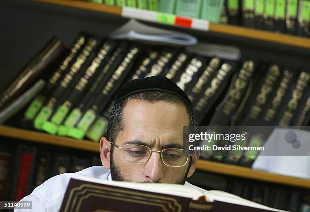 Religious Jewish Kabbalah scholar reads from the Talmud holy book during his studies at leading Kabbalist Rabbi Yitzhak Kadouri's synagogue August 4,...