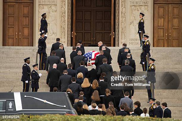 The casket containing the body of the late Supreme Court Justice Antonin Scalia is carried into the Basilica of the National Shrine of the Immaculate...