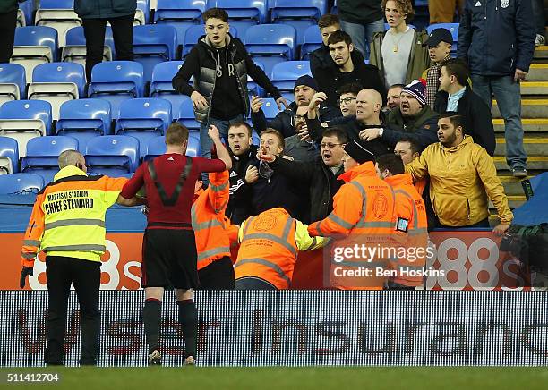 Chris Brunt of West Bromwich Albion reacts after being hit by an object during the Emirates FA Cup fifth round match between Reading and West...