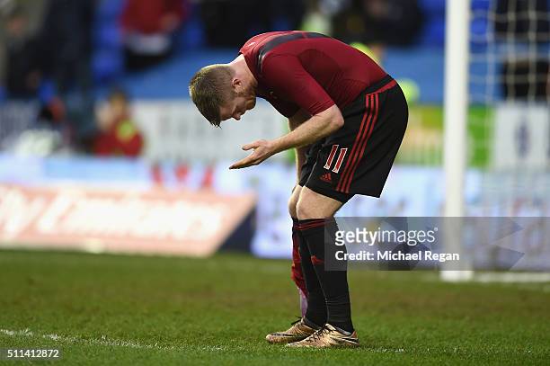 Chris Brunt of West Bromwich Albion reacts after being hit by an object during the Emirates FA Cup fifth round match between Reading and West...