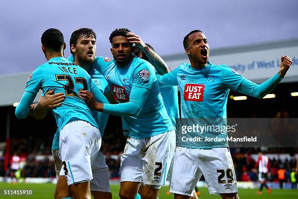 Chris Martin of Derby celebrates with his teammates after he scores his sides third goal during the Sky Bet Championship match between Brentford and...