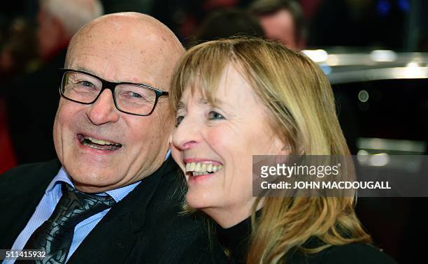 German filmmaker Volker Schloendorff and his wife Angelika Schloendorff arrive on the red carpet to attend the awards ceremony of the 66th Berlinale,...