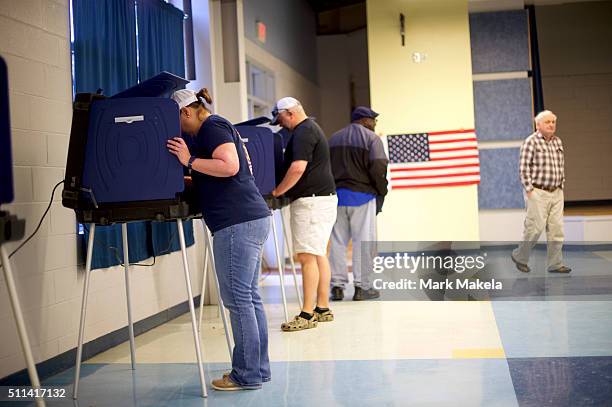 People cast their votes at the Forrest Middle School polling precinct on February 20, 2016 in Walterboro, South Carolina. Statewide voters will cast...