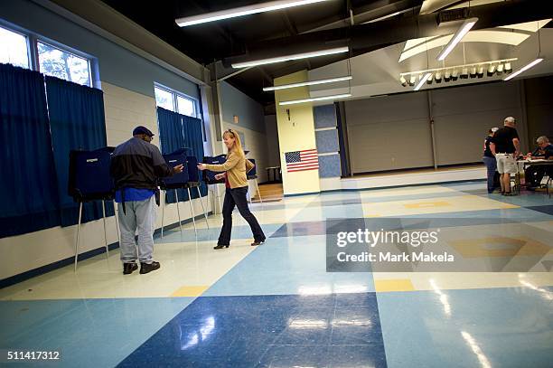 People cast their votes at the Forrest Middle School polling precinct on February 20, 2016 in Walterboro, South Carolina. Statewide voters will cast...