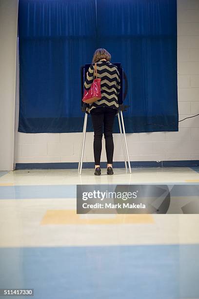 Woman votes at the Forrest Middle School polling precinct on February 20, 2016 in Walterboro, South Carolina. Statewide voters will cast ballots...