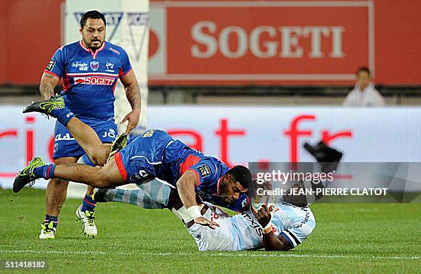 Grenoble's Fijian winger Maritino Nemani vies with Racing 92's French flanker Yannick Nyanga during the French Top 14 rugby union match Grenoble vs...