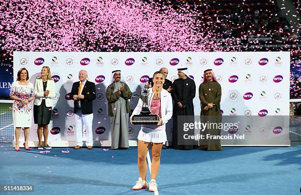 Sara Errani of Italy poses with the winning trophy after winning the women's final match of the WTA Dubai Duty Free Tennis Championship at the Dubai...