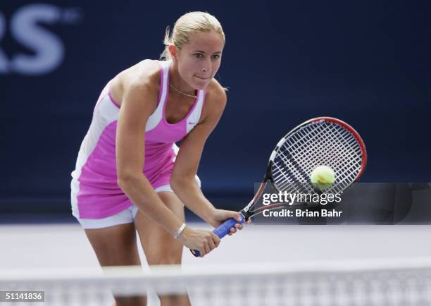 Gisela Dulko of Argentina drops a shot over the net against Elena Dementieva of Russia during the second round of the Rogers Cup tennis on August 4,...