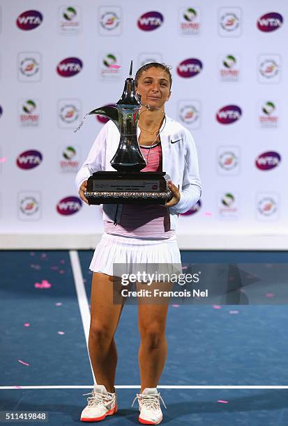 Sara Errani of Italy holds the trophy after defeating Barbora Strycova of Czech Republic during the women's final match of the WTA Dubai Duty Free...