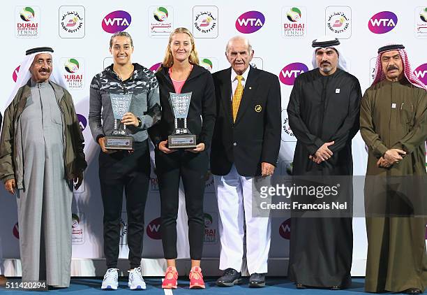 Caroline Garcia of France and Kristina Mladenovic of France holds the runner up trophy after the women's doubles final match of the WTA Dubai Duty...