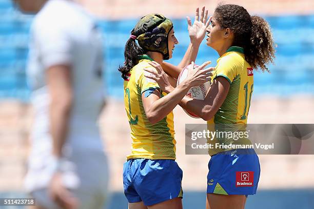 Julia Sarda and Bianca Silva of Brazil celebrate in the game against England during the Women's HSBC Sevens World Series at Arena Barueri on February...