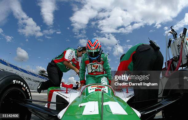 Tony Kanaan climbs aboard the Andretti Green Racing Team 7-Eleven Honda Dallara during practice for the Indy Racing League IndyCar Series Menards...