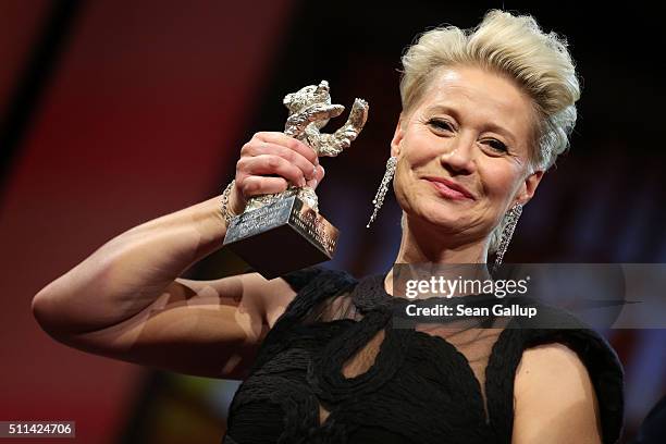 Trine Dyrholm, winner of the Silver Bear for Best Actress, poses with her award on stage during the closing ceremony of the 66th Berlinale...