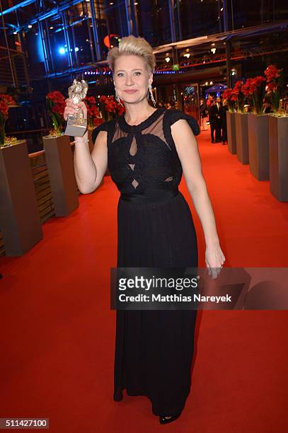 Trine Dyrholm, winner of the Silver Bear for Best Actress, poses with her award after the closing ceremony of the 66th Berlinale International Film...