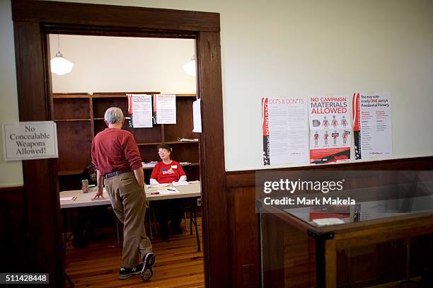 Man registers before voting at the Denmark Depot polling precinct on February 20, 2016 in Denmark, South Carolina. Statewide voters will cast ballots...