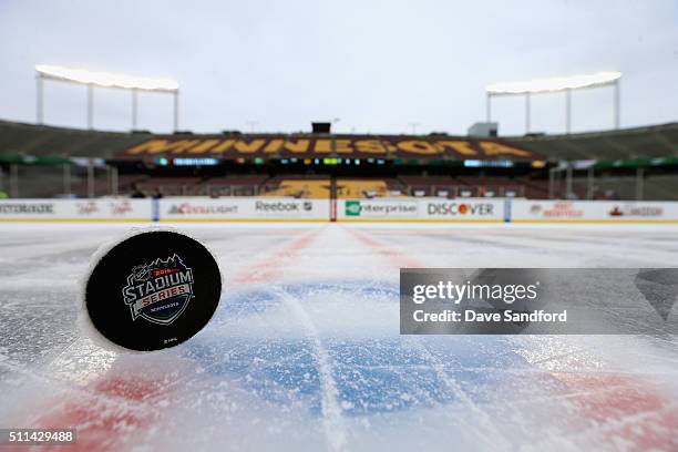 An official 2016 Coors Light Stadium Series puck is seen on the ice surface during practice day for the 2016 Coors Light Stadium Series game between...