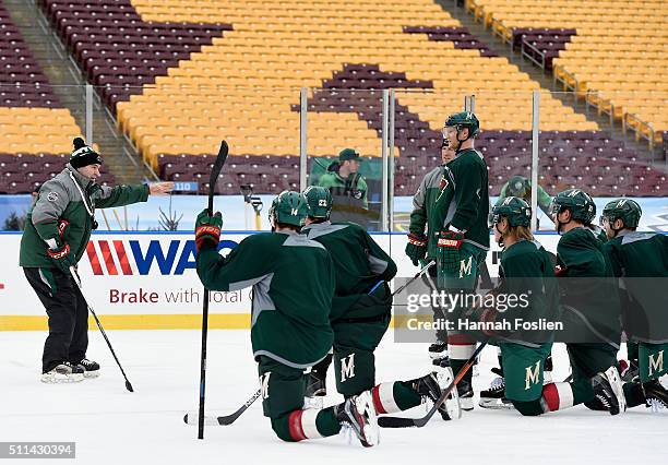 Interim head coach John Torchetti of the Minnesota Wild speaks to the team during practice day at the 2016 Coors Light Stadium Series on February 20,...