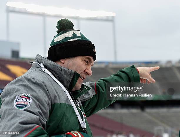 Interim head coach John Torchetti of the Minnesota Wild speaks to a player during practice day at the 2016 Coors Light Stadium Series on February 20,...