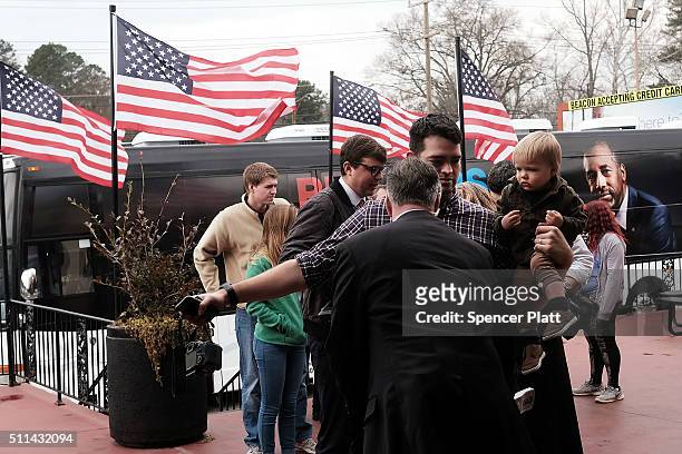 People are searched by the Secret Service as Republican presidential candidate Ben Carson visits voters in a restaurant during the Republican...