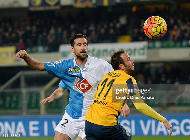 Gianpaolo Pazzini of Hellas Verona competes with Nicolas Spolli of Chievo Verona during the Serie A match between Hellas Verona FC and AC Chievo...