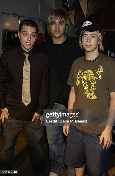 Matt Jay, Charlie Simpson, and James Bourne of the band Busted attend the afterparty following the UK Premiere of "I, Robot" on August 4, 2004 at...