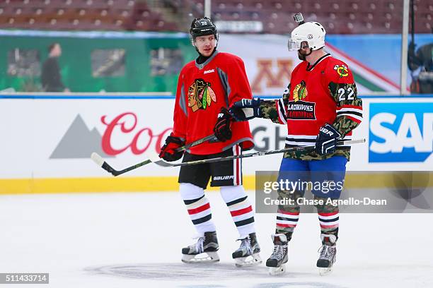 Artemi Panarin of the Chicago Blackhawks speaks to a member of the Wounded Warrior hockey team during practice day for the 2016 Coors Light Stadium...